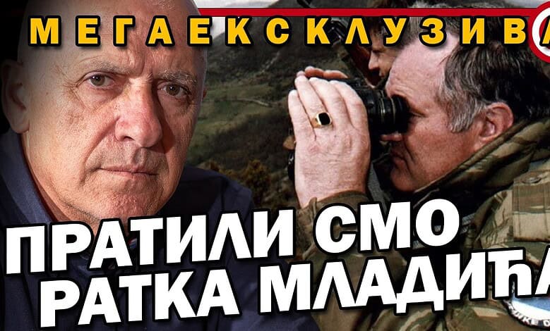 Слика са два човека, један са фотоапаратом, у војној униформи.